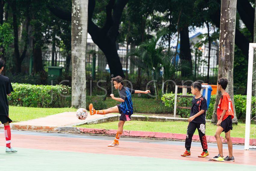 Kids playing a football match